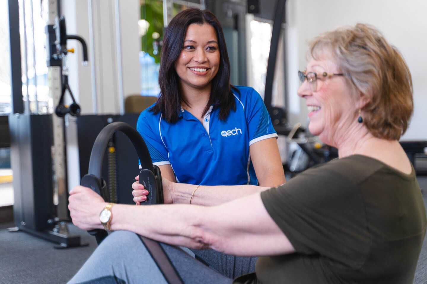 ECH physiotherapy worker assisting an elderly woman